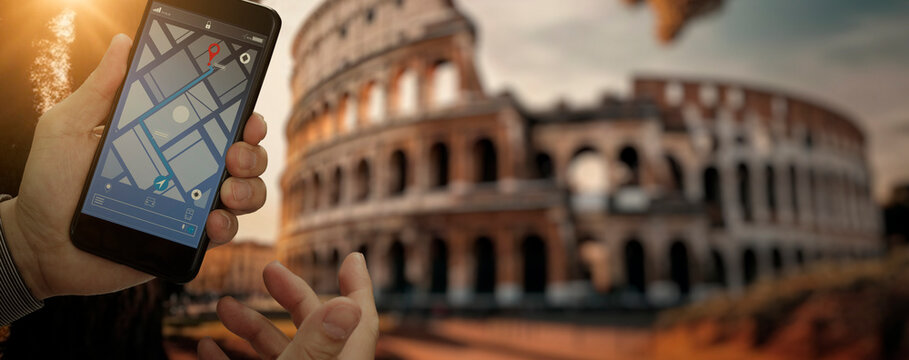 Traveller using smartphone navigator map find Coliseum in Italy Rome.