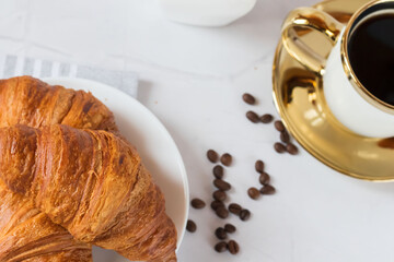 Morning with a cup of coffee and croissants. On a white background. Breakfast.