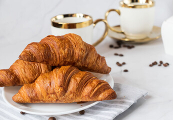 Morning with a cup of coffee and croissants. On a white background. Breakfast.