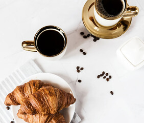 Morning with a cup of coffee and croissants. On a white background. Breakfast.