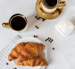 Morning with a cup of coffee and croissants. On a white background. Breakfast.
