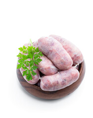 Set of turkey spicy sausages in wooden bowl isolated on white background