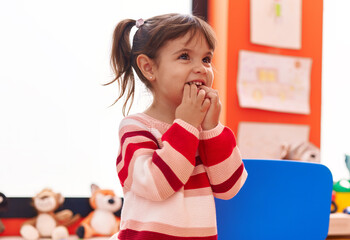 Adorable hispanic girl smiling confident standing at kindergarten