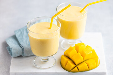 Mango milkshake in a glass, selective focus