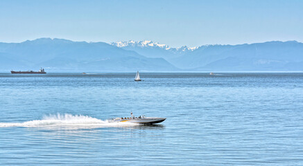 Power motor boat running over the bay with tourist tour