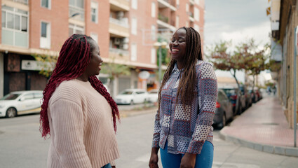 Two african american friends smiling confident standing together at street