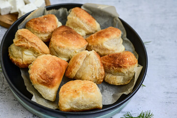 Fresh baked home made  Mini cheese puff pastries.Cheese pie with phyllo pastry and herbs