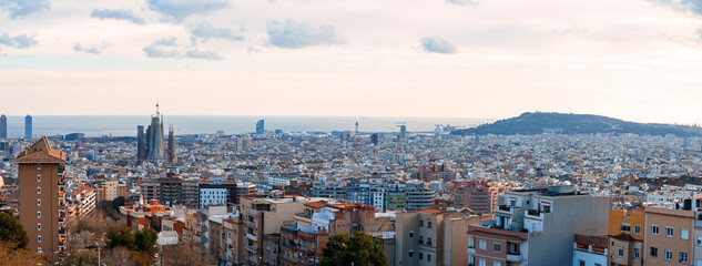 Aerial view of Barcelona cityscape with Sagrada Familia and buildings with sea in the background...