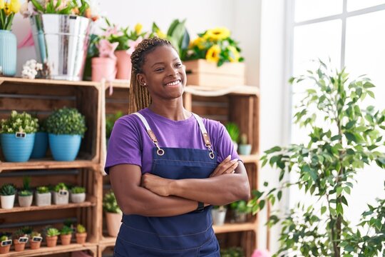 African american woman florist smiling confident standing with arms crossed gesture at florist