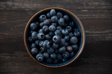 blueberries in a bowl on table