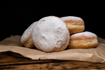 Polish pączki deep-fried doughnuts. Celebrating Fat Thursday, Tłusty czwartek feast, traditional...