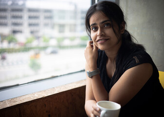 portrait of a woman drinking coffee