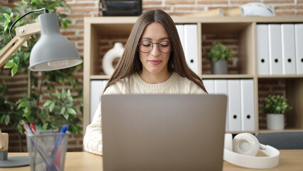 Young beautiful hispanic woman business worker using laptop working at office