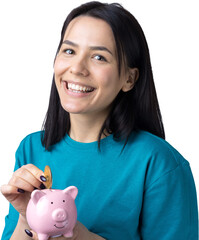 The girl holds a pink piggy bank and a coin in her hands. The concept of wealth and accumulation.