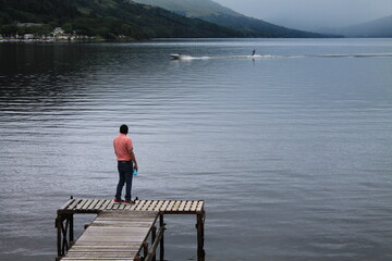 Fototapeta na wymiar Vistor watching a water skier