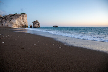 Fototapeta na wymiar A quiet beach near Aphrodite's Rocks in Cyprus 
