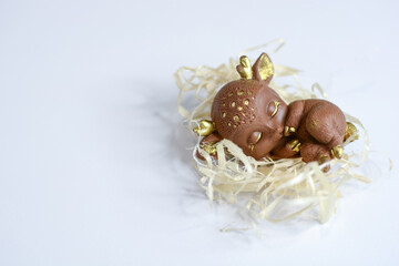 Chocolate cute fawn on a light background. Chocolate candies