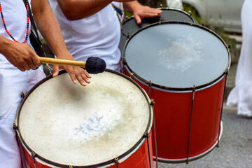 Fototapeta na wymiar Drums being played in the streets of the city of Belo Horizonte during a samba performance at the Brazilian street carnival