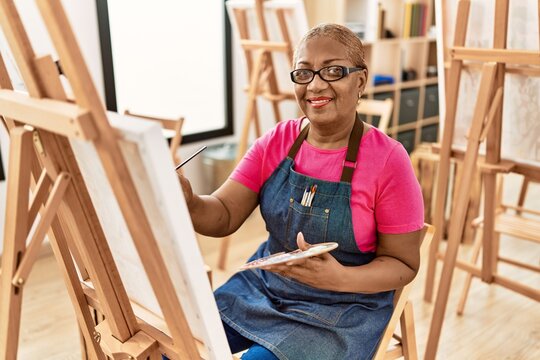 Senior african american woman smiling confident drawing at art studio