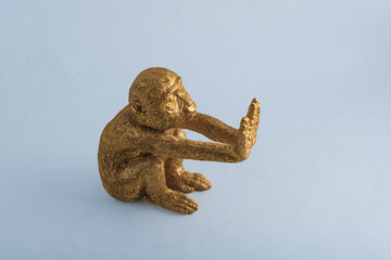 the figure of a monkey making gestures