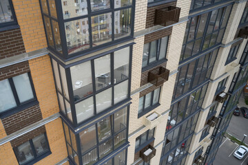 Building exterior with decorative air conditioner covers