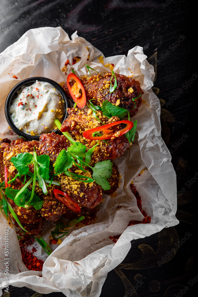 Poster fried bbq chicken wings in plate