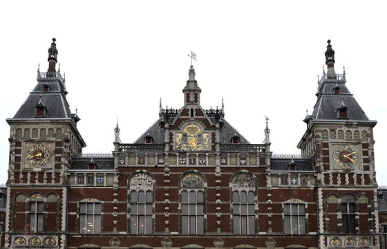 Amsterdam Central Station Building On A Clouded Day With White Sky