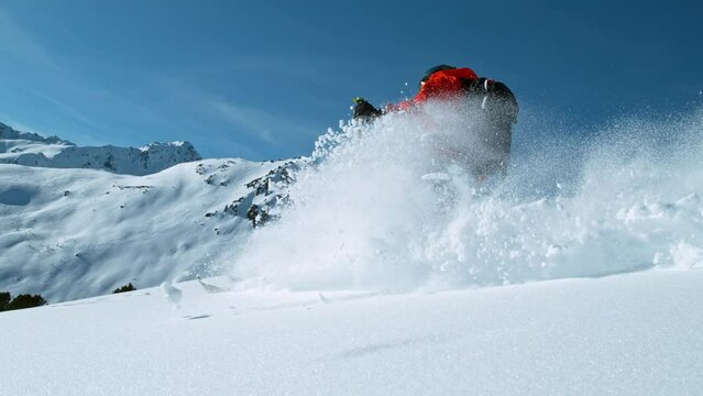 Freeride skier riding in the scenic mountains. Super slow motion at 1000 fps.