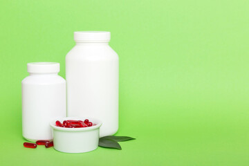 different drugs and health supplement pills with medicine bottle health care and medical top view. Vitamin tablets. Bottle with colored pills on table background. Multivitamins