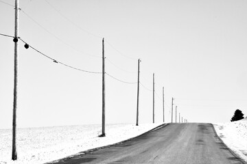Empty country road through the countryside in winter