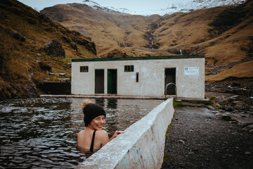 Woman blogger at Seljavellir Hot Tubs, Iceland