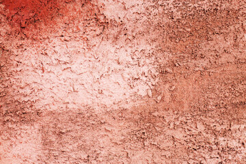 Decorative plaster concrete background. Multicolor red and brown wall close up