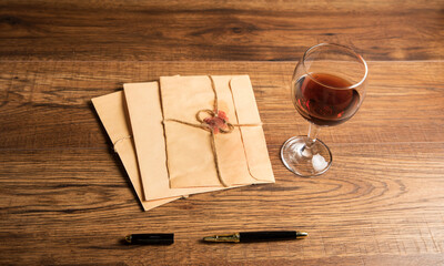 Naklejka na ściany i meble Vintage paper letter and glass of wine