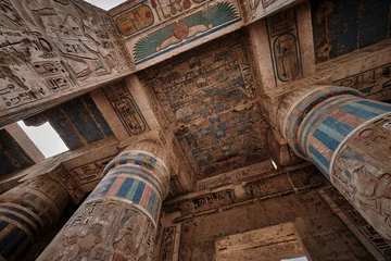 Deurstickers Mortuary Temple of Ramesses III at Medinet Habu in Luxor, Egypt showing Ceiling decoration in the peristyle hall with preserved colors © Mohamed