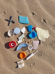 Fototapeta na wymiar Plastic pollution. Plastic waste on the beach. Threat to animals and birds.