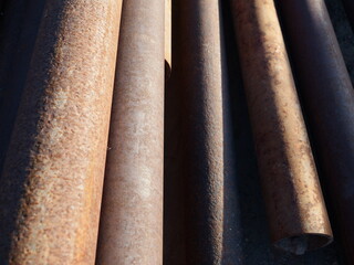 Stack of rusted steel pipe
