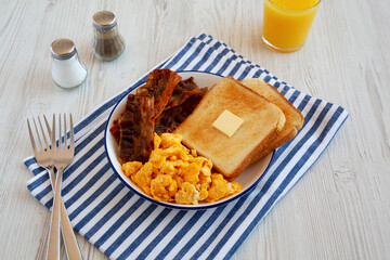 Homemade American Scrambled Egg Breakfast on a Plate, side view.
