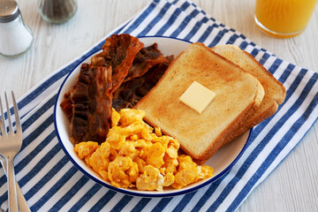 Homemade American Scrambled Egg Breakfast on a Plate, side view.