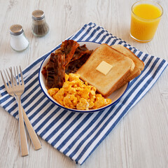 Homemade American Scrambled Egg Breakfast on a Plate, side view.
