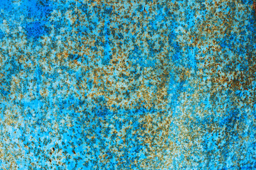 Rusty metal abstract background. Texture of an old blue grunge metal plate with cracked paint.