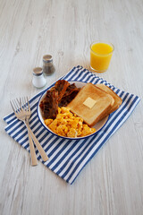 Homemade American Scrambled Egg Breakfast on a Plate, side view.