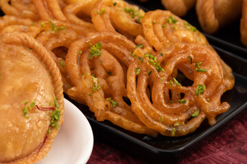 Jalebi Also Called Jilapi, Jilebi, Jilipi, Zulbia, Jerry, Zalebi, Mushabak Is Indian Mithai Made Of Fermented All Purpose Flour Maida, Besan Fried In Desi Ghee Dunked In Sugar Syrup Cheeni Ki Chasni