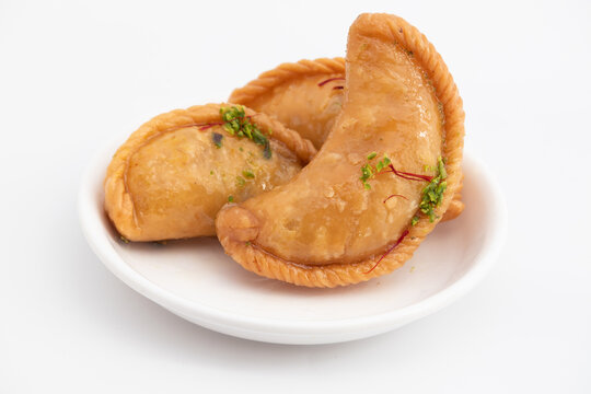 Gujia Also Called Gujiya, Pirukiya, Pirukia, Pedakiya, Karanji, Basundi Or Gughra Stuffed With Mawa, Khoya, Chasni, Mava, Khoa - Indian Sweet Dumpling Enjoyed On Deepawali, Teez, Holi, Diwali And Teej