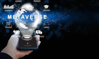 Metaverse on a smartphone. A hand holding a phone activates Metaverse on the virtual screen. The use of augmented reality technology. The Internet as a single, universal, and immersive virtual world.