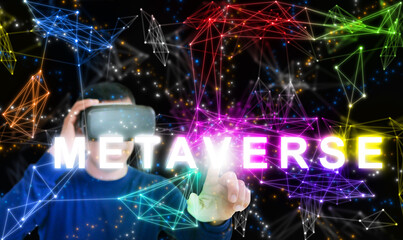 Metaverse. A man wearing VR glasses enters the Metaverse through a goggle. The use of virtual and augmented reality technology. The Internet as a single, universal, and immersive virtual world.