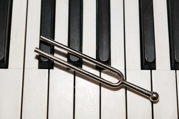 tuning fork tool on piano keys