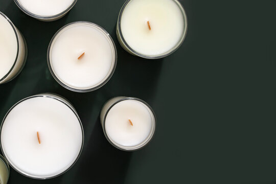 Soy and coconut candle handmade on light green background. Scented handmade candle. Cozy home decor. Holiday concept. Relax, lifestyle concept.