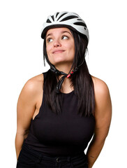 Young caucasian woman wearing a helemet isolated dreaming of achieving goals and purposes