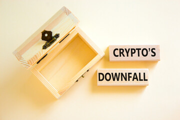 Crypto downfall symbol. Concept words Cryptos downfall on wooden blocks. Beautiful white table white background. Wooden empthy chest. Business and crypto downfall concept. Copy space.