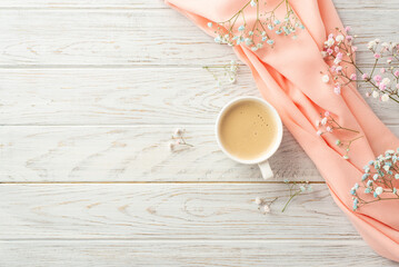 Hello spring concept. Top view photo of cup of frothy coffee gypsophila flowers and pink scarf on...